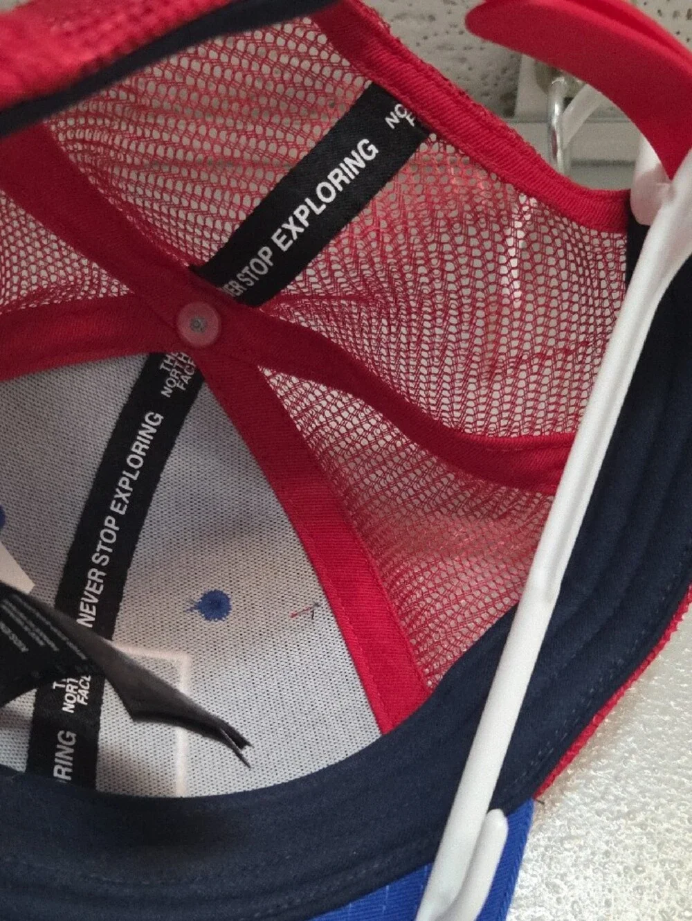 The North Face Kids Royal Blue and Red Mesh Trucker Hat